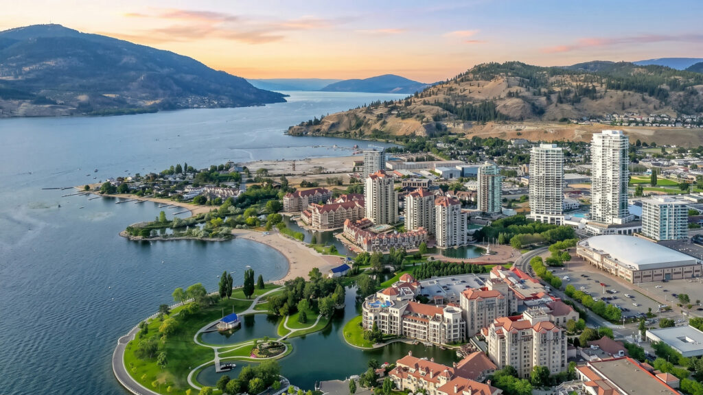 Aerial view of downtown Kelowna at sunset: Okanagan Lake, Waterfront Park, the lagoon and the bridge to West Kelowna